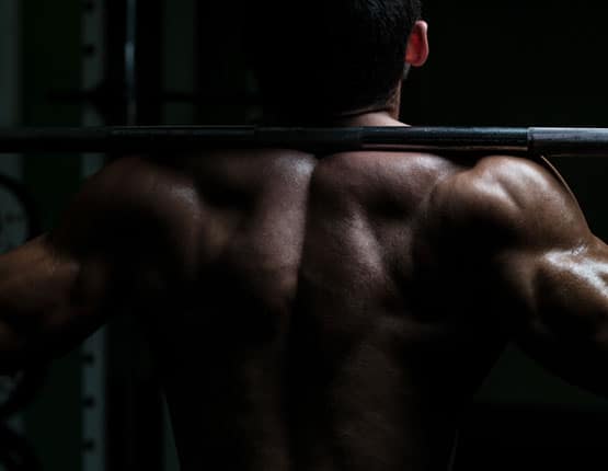 Image of a man and woman doing weights